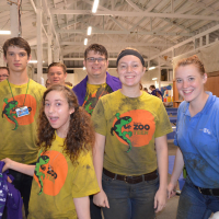 A group of ZOOTeens volunteers pose after a rainy Clean Your Streams Day.