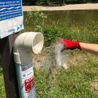 Properly disposed fishing line is removed from a recycling bin in order to be recycled.