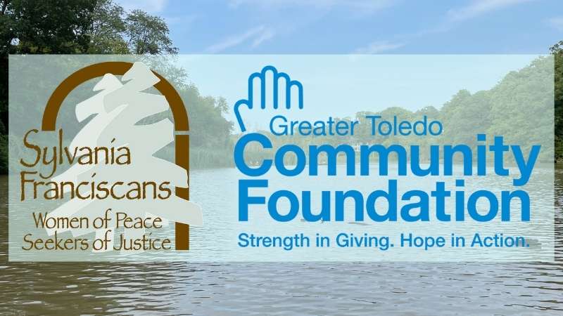 Logos for the Sisters of St. Francis and Greater Toledo Community Foundation over the Maumee River.