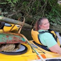 PCS Board Member Denise Fonner proud of her paddle clean-up wheelbarrow find.