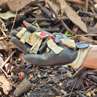 A Clean Your Streams 365 volunteer collects microplastics marine debris on their glove.