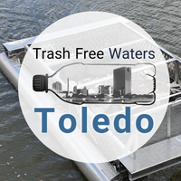 Trash Free Waters Toledo logo overtop of a "Brute Bin" trash trap device in Swan Creek, Toledo, Ohio.